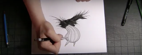 Artist drawing a monster.