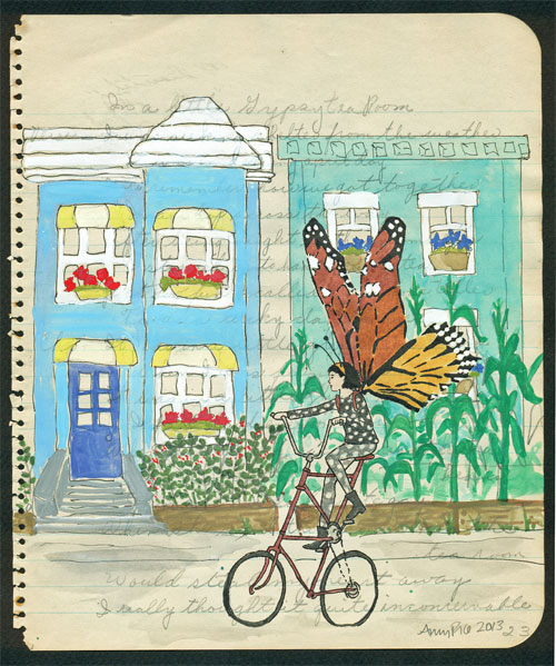 Girl with butterfly wings on a bike.