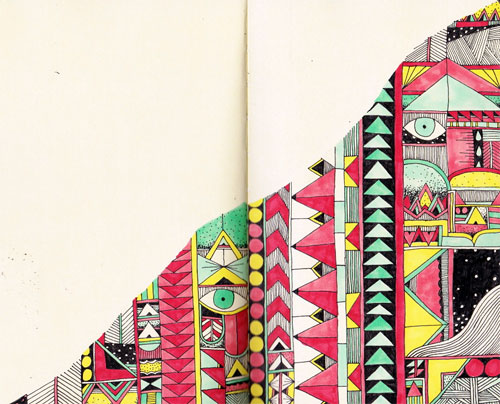 Multicolored geometric drawing across the bottom half of two pages of a sketchbook