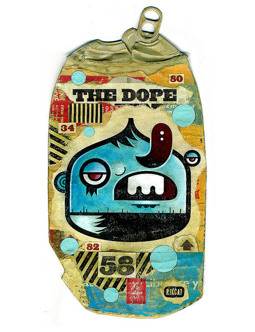 A smashed soda can with an illustration of a quirky character called "the dope"