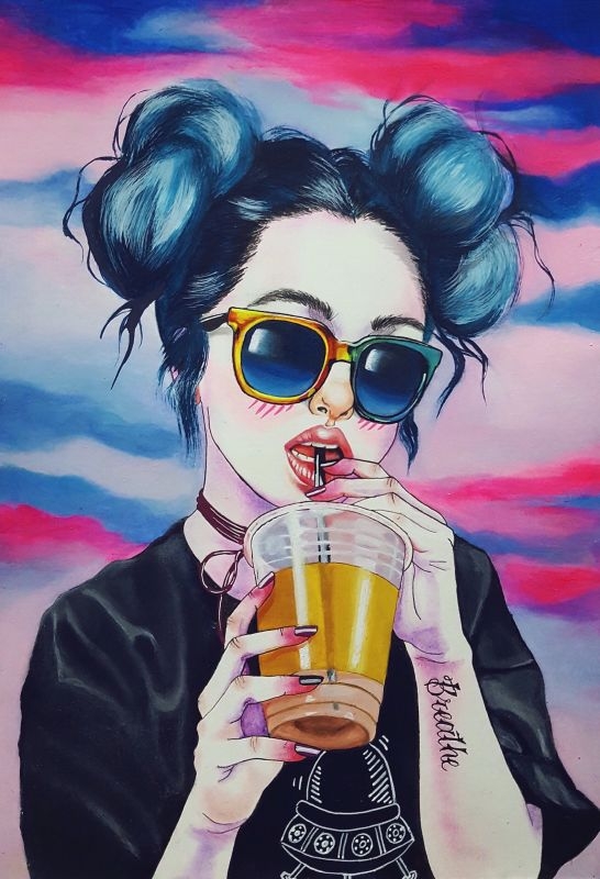 Portrait of a girl with glasses and holding a cup.