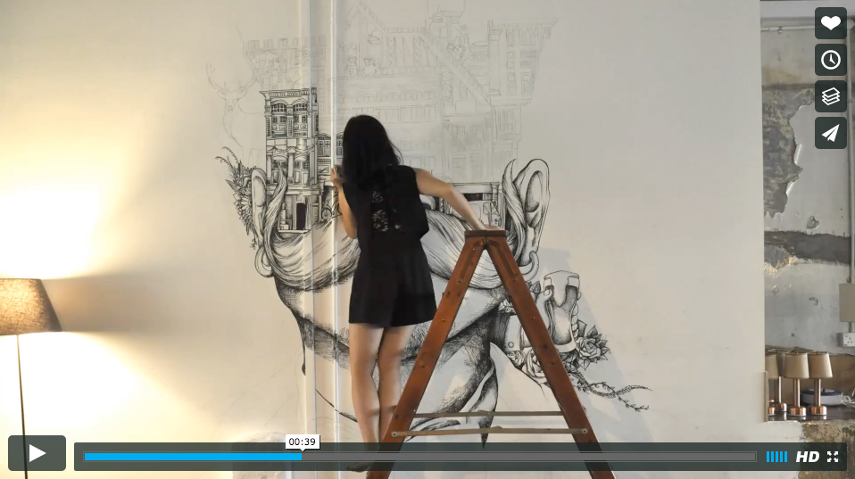 Video of artist drawing a mural.