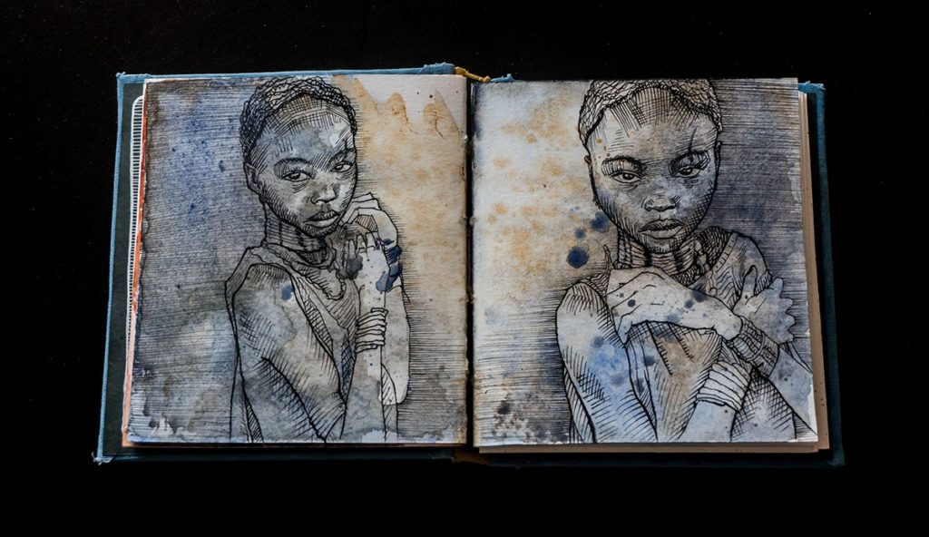 Sketchbook with two portraits.