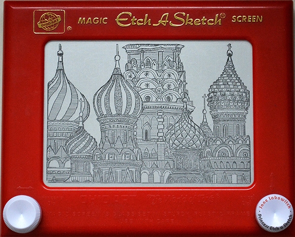 Drawing on an etch a sketch.