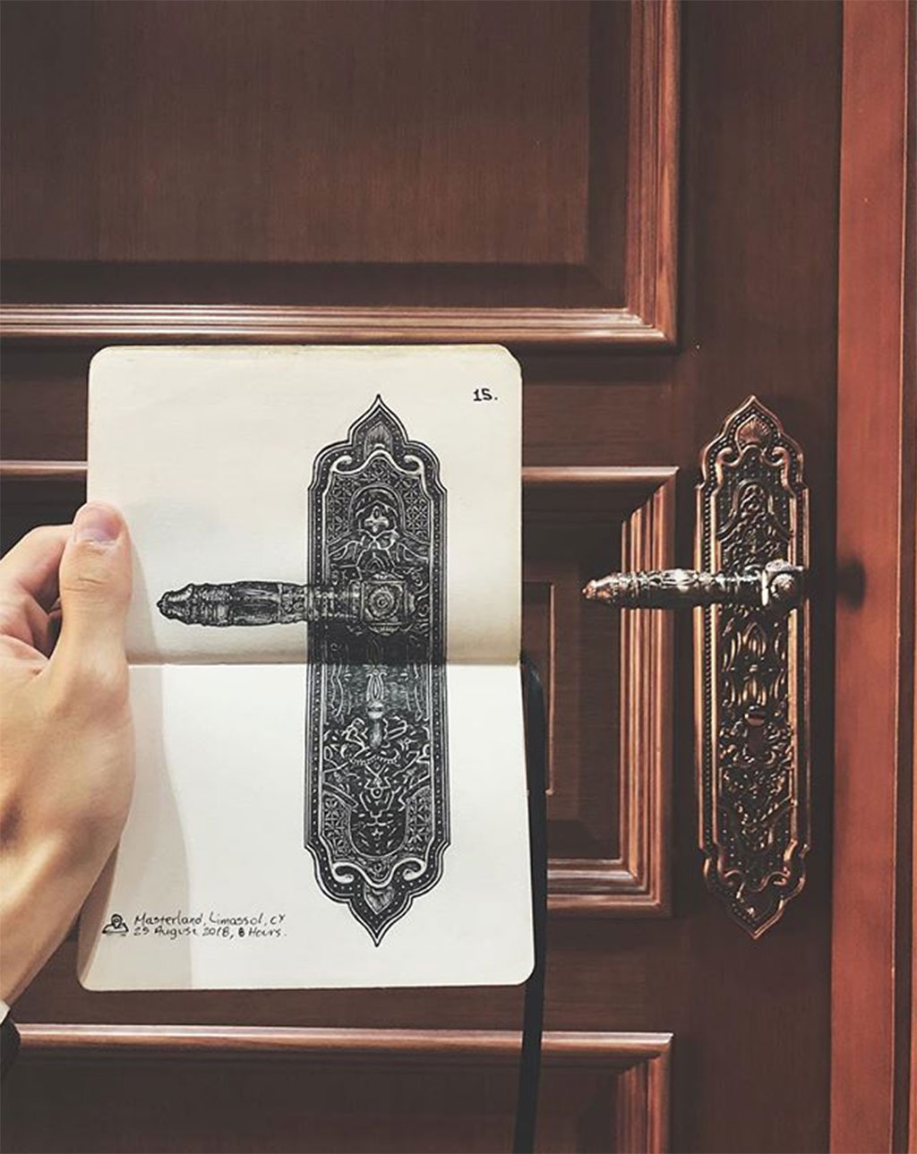 Detailed drawing of an elaborate door handle, side by side with the real door handle